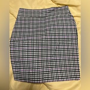 Black, Purple, white stripped skirt.